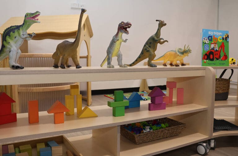 Children at Starfish ELC engaging in play-based learning, mealtime, and creative activities with caring educators