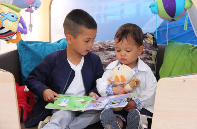 Young children engaged in play-based learning activities at Starfish Early Learning Centre, supported by caring educators