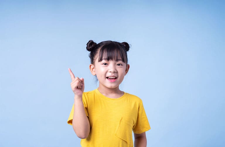 young child smiling confidently while engaging in a supportive early learning environment at Starfish Early Learning Centre