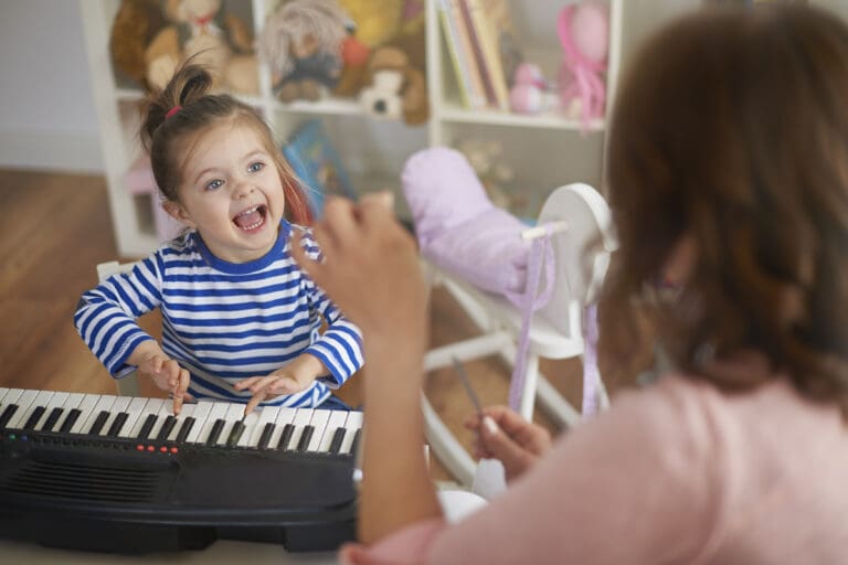 Children singing and playing instruments during music activities at Starfish Early Learning Centre