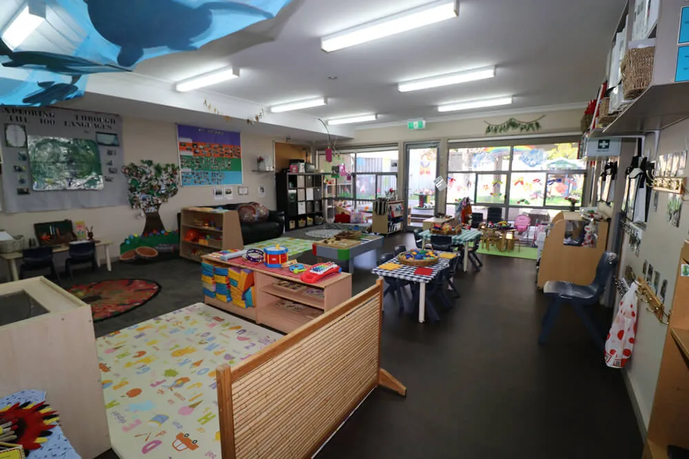 Indoor learning room with art, reading and construction areas
