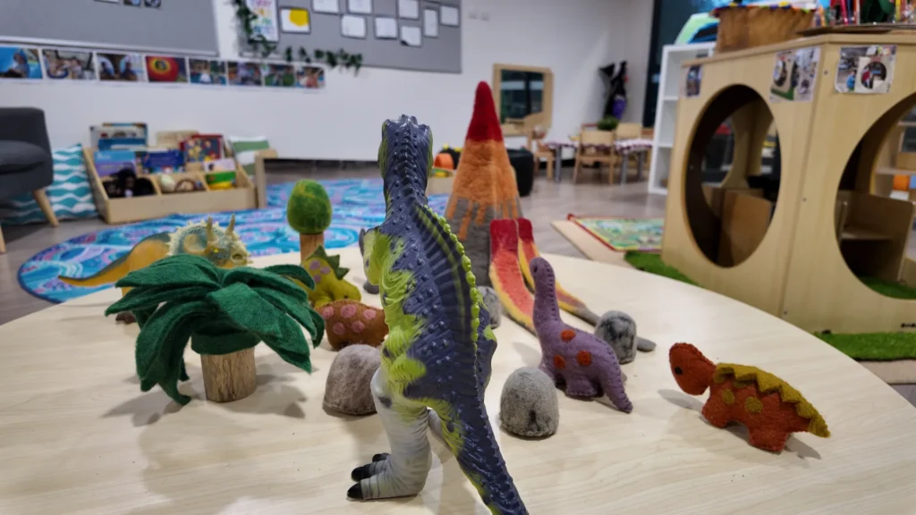 Dinosaur play activity in the indoor learning room at Starfish Early Learning Centre Essendon