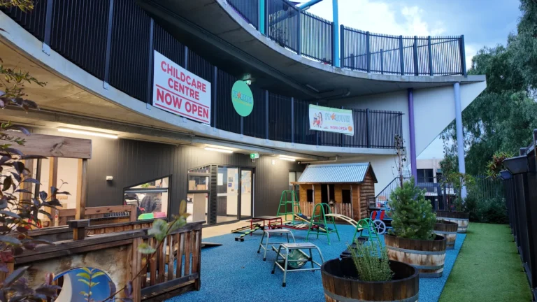 Outdoor playground at Starfish Early Learning Centre Essendon with childcare centre signage
